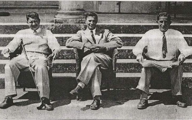 Black and white photograph of three men seated at Sidmouth Golf Club